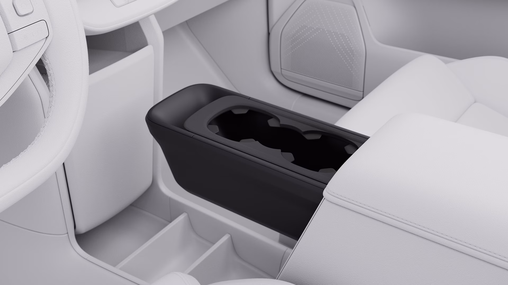 Крупный план центральной консоли автомобиля Volvo с подстаканниками и отсеками для хранения в современном интерьере.