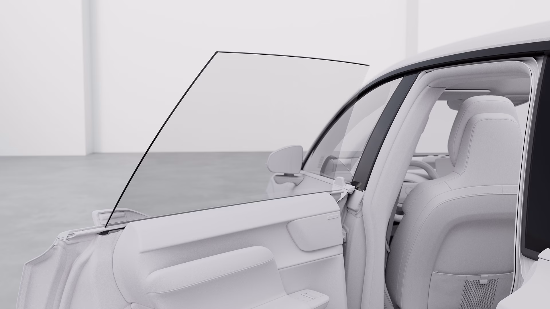 Крупный план открытой передней двери автомобиля Volvo, подчеркивающий оконное стекло и детали салона.