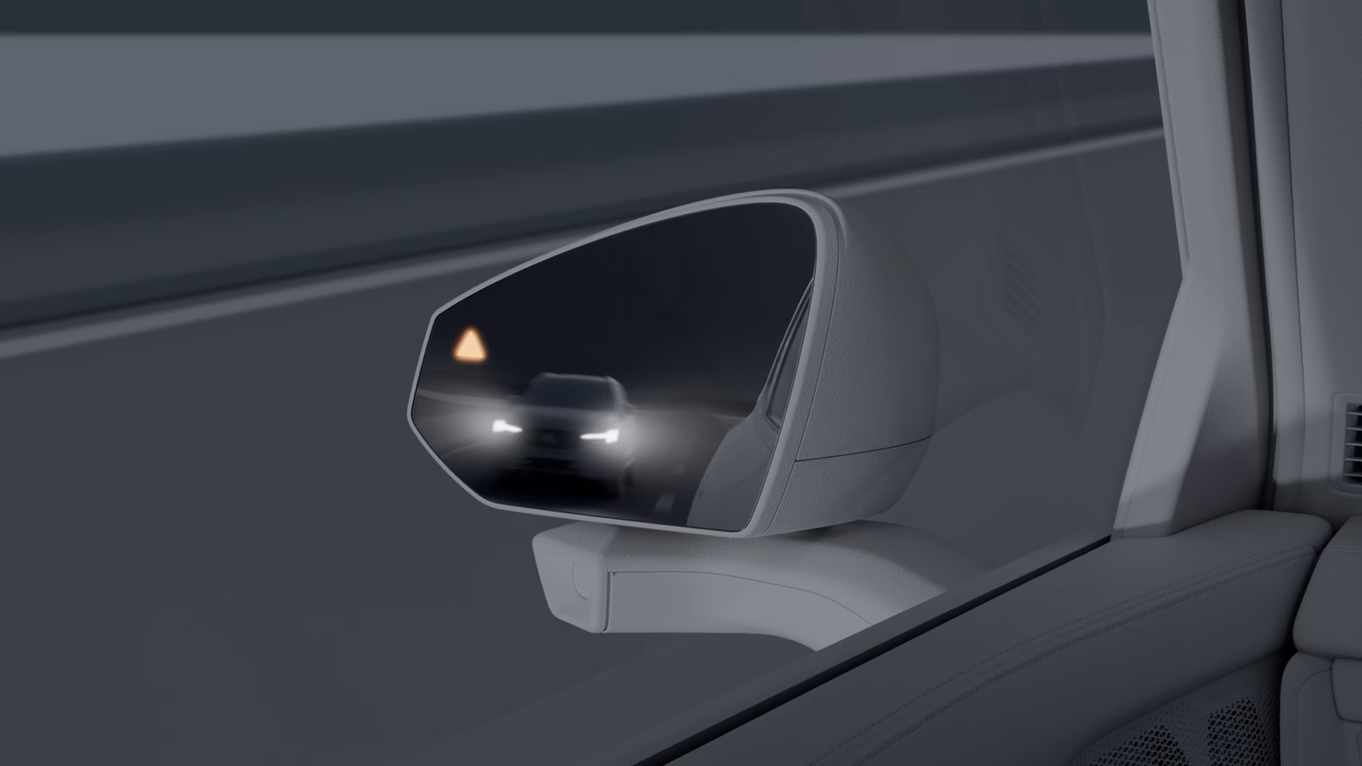 Боковое зеркало Volvo с индикатором слепой зоны при приближении автомобиля сзади.