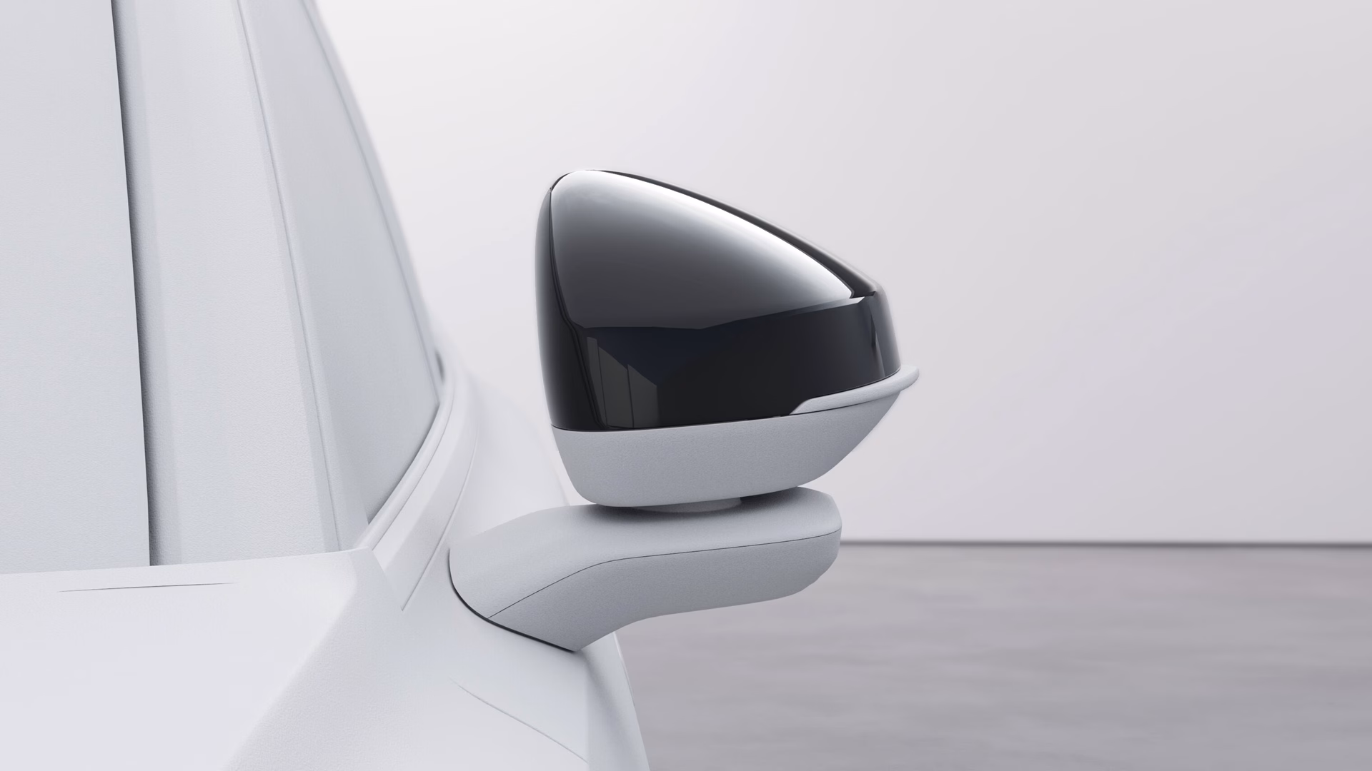Боковое зеркало Volvo крупным планом с элегантным современным дизайном.