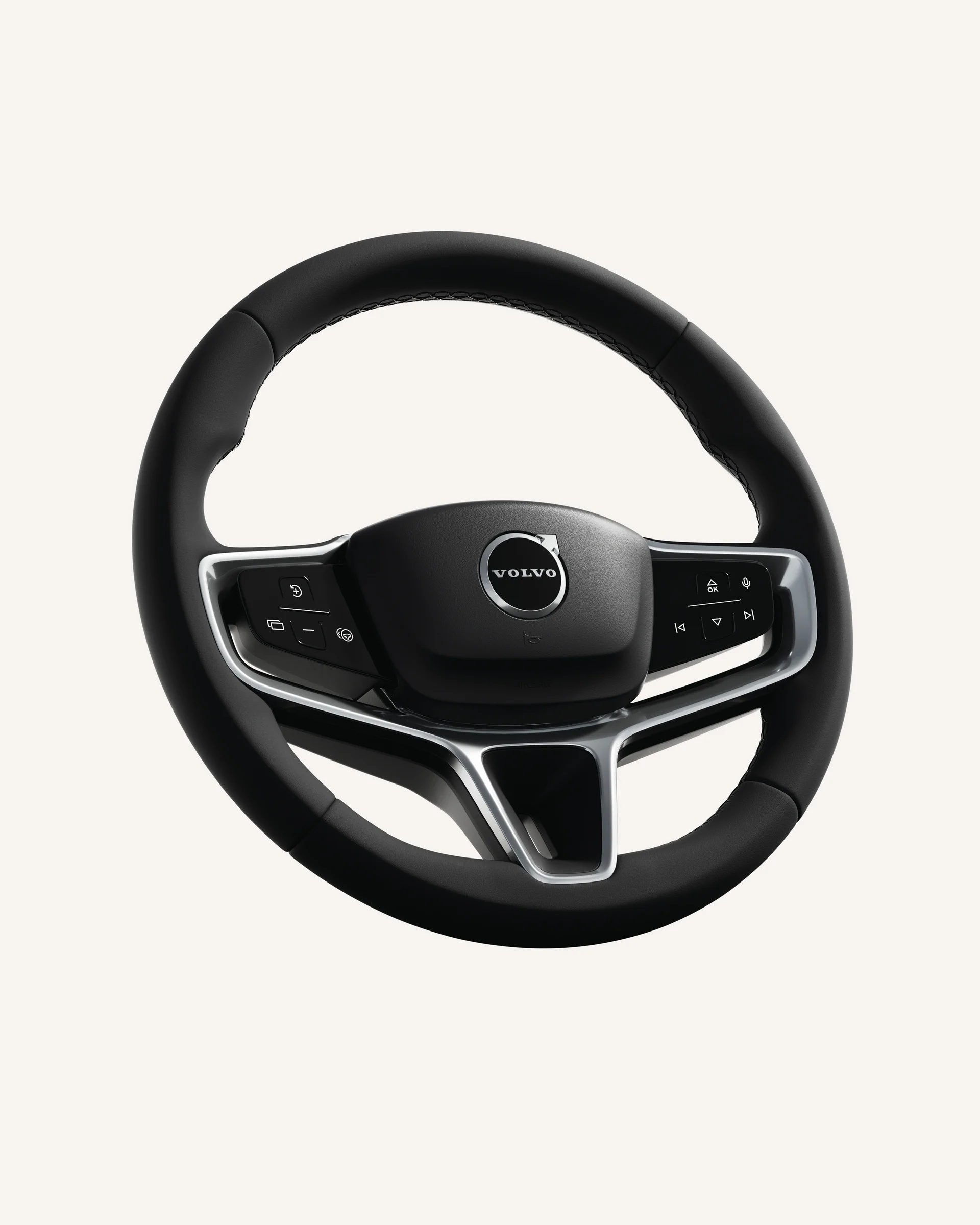 Крупный план рулевого колеса Volvo EX90 со встроенными органами управления.