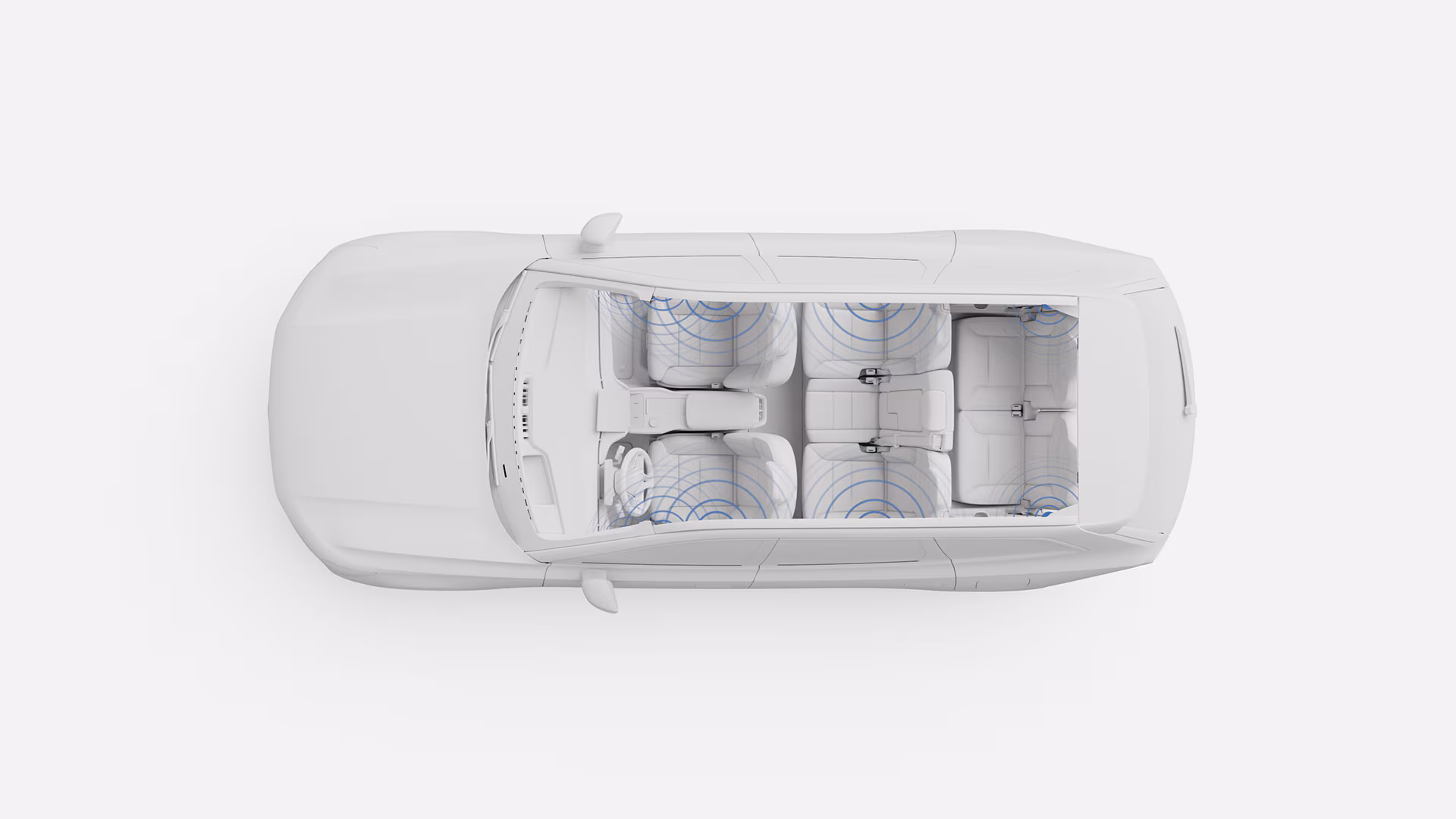 Вид сверху вниз на салон автомобиля Volvo, сиденья выделены синими кругами, иллюстрирующими покрытие аудиосистемы или акустической системы автомобиля.