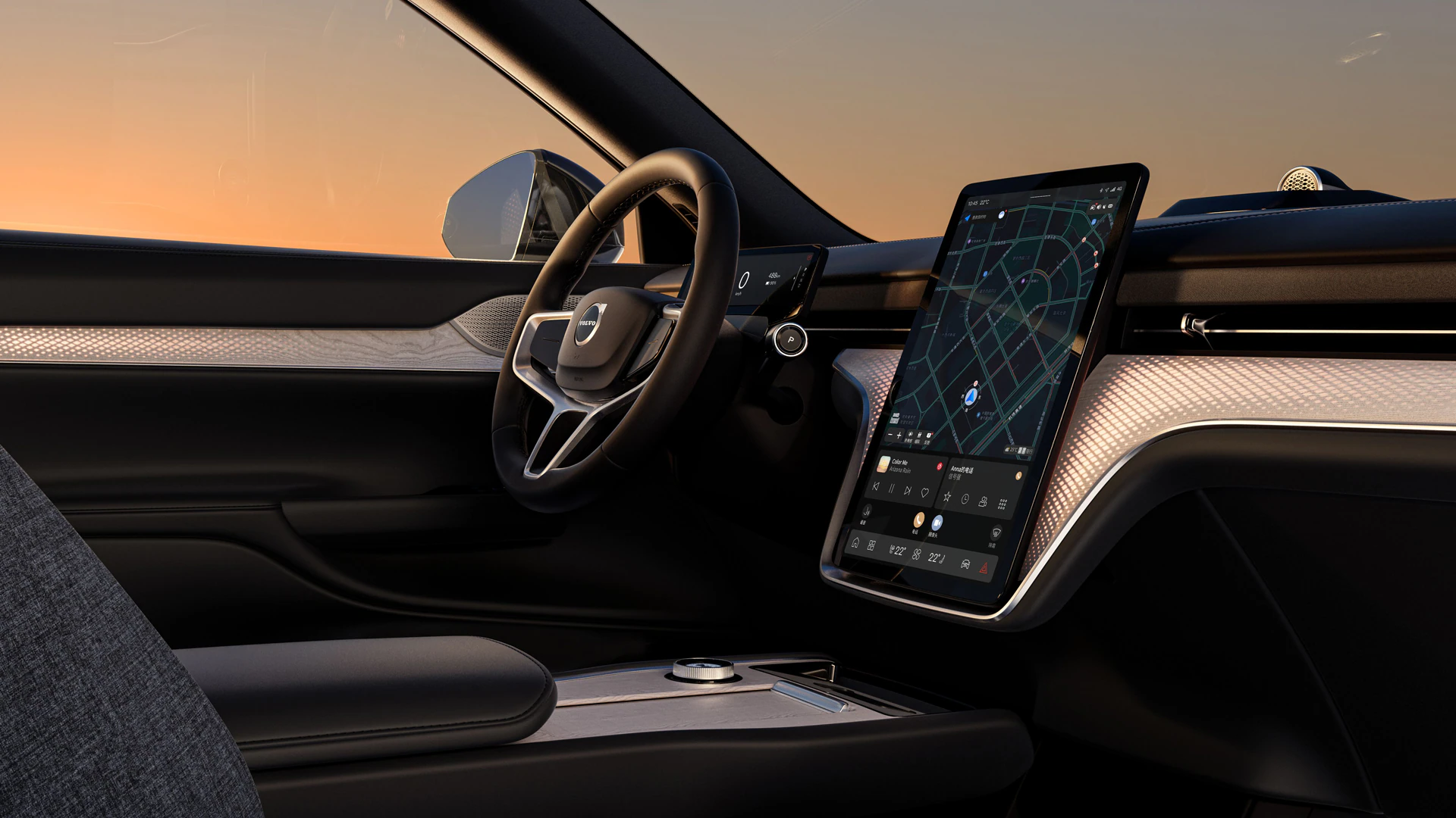 Салон автомобиля Volvo с рулевым колесом, цифровым дисплеем водителя и большим центральным сенсорным экраном с навигацией и элементами управления.